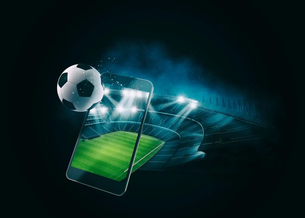 Smartphone mit Ball und Stadion im Hintergrund